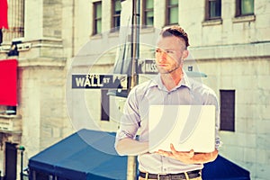 Young handsome man traveling, working in New York City