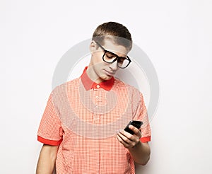 young handsome man typing sms on white background