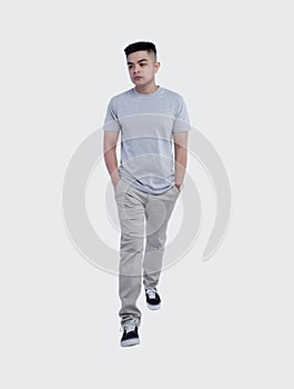 Young handsome man was posing wearing heather grey t-shirt short sleeve with mockup concept