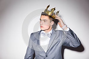 Young handsome man wearing suit looking at camera