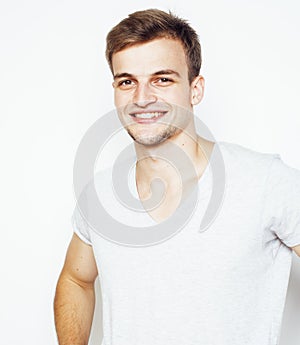 Young handsome man on white background gesturing, pointing, posing emotional, cute guy