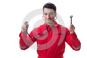 The young handsome man with wrench and stethoscope isolated on white