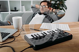 Musician relaxing at modern office photo