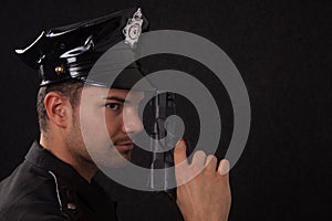 Young handsome policeman with gun