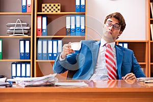 The young handsome politician sitting in office