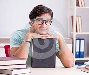 Young handsome student preparing for school exams