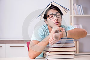 The young handsome student preparing for school exams