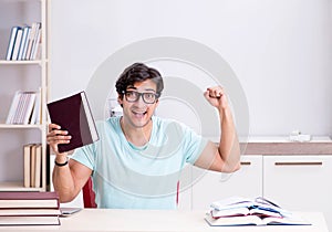 Young handsome student preparing for school exams