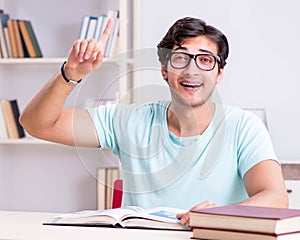 Young handsome student preparing for school exams