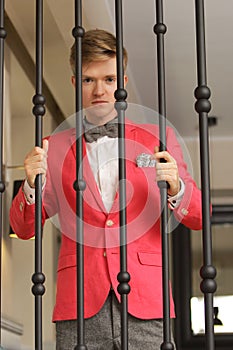 Young handsome stylish man posing indoor