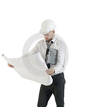 Young handsome technician working with drawing plans on white