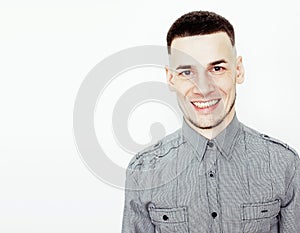 Young handsome teenage hipster guy posing emotional, happy smiling against white background isolated, lifestyle people