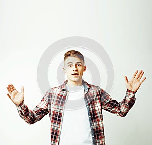 Young handsome teenage hipster guy posing emotional, happy smiling against white background isolated, lifestyle people