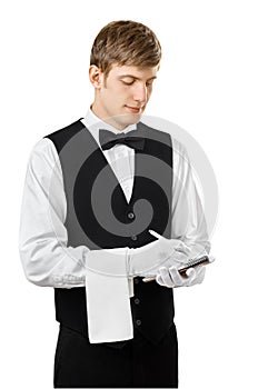 Young handsome waiter taking order