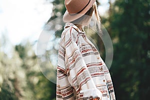 Young handsome woman wearing hat traveling and smiling