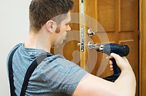 Man changing door lock