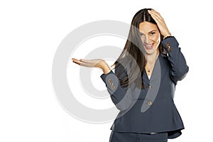 Young happy advertizing business woman in  jacket photo