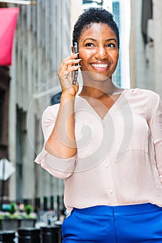 Young Happy African American Woman with short afro hair, traveling in New York City