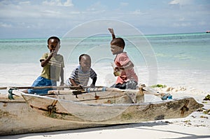 Young happy african boys on fishing boat