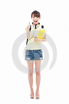 Young happy Asian student show thumb