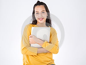 Young happy Asian student woman holding laptop on white background.