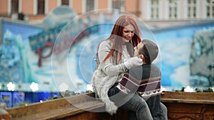 Young Happy Attractive Amorous Couple Embracing And Kissing Outdoor. Merry Christmas and New Year Concept. Good Mood and