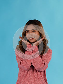 Young happy attractive asian girl in studio