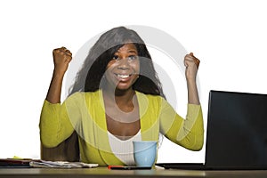 Young happy and attractive black African American business woman smiling cheerful and confident working at office computer desk ce