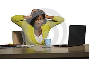 Young happy and attractive black African American business woman smiling cheerful and confident working at office computer desk ce