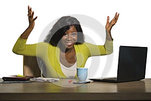 Young happy and attractive black afro American business woman smiling cheerful and confident working at office computer desk celeb