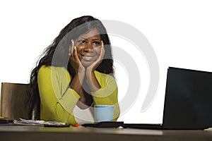 Young happy and attractive black Afro American business woman smiling cheerful and confident working at office computer desk relax