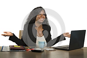 Young happy and attractive black afro American business woman working at office computer desk smiling successful posing corporate