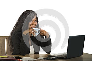 Young happy and attractive black afro American business woman working at office computer desk smiling successful posing corporate