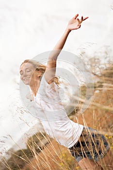 Young happy attractive woman arms wide open