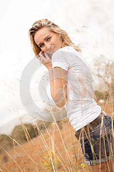 Young happy attractive woman arms wide open