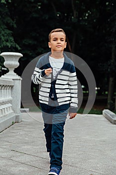 Young happy beautiful caucasian girl walking defile showing fashionable clothes. fooling around.