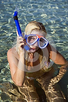 Young happy beautiful summer diving woman