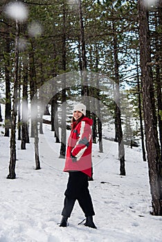 Young happy and beautiful teenage standing at snow and smiling