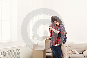 Young happy black couple dancing at home, copy space