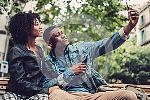 Young happy black couple outdoors