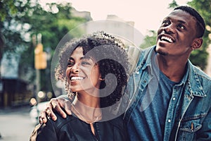 Young happy black couple outdoors