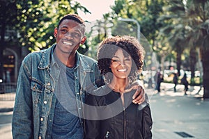 Young happy black couple outdoors