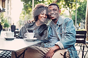 Young happy black couple outdoors