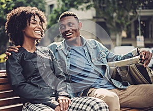 Young happy black couple outdoors