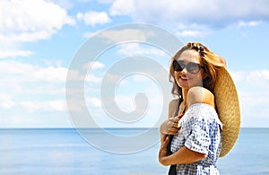 Young happy blond woman at beautiful tropical paradise view of ocean enjoying summer holidays