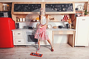 Woman Is Having Fun While Doing Cleaning At Home photo