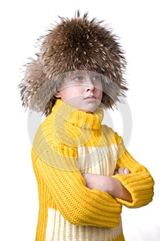 Young happy boy in fur hat