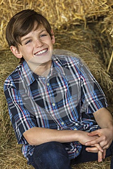 Young Happy Boy Smiling on Hay Bales