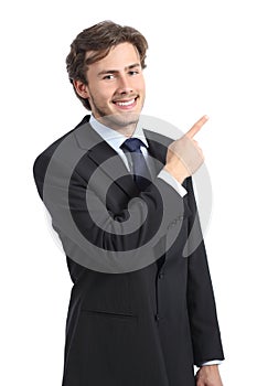Young happy business man pointing at side