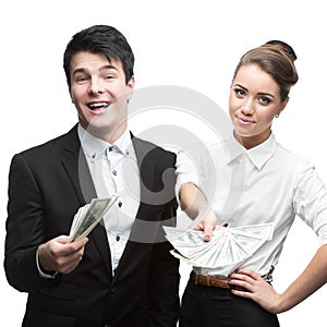 Young happy business people holding money